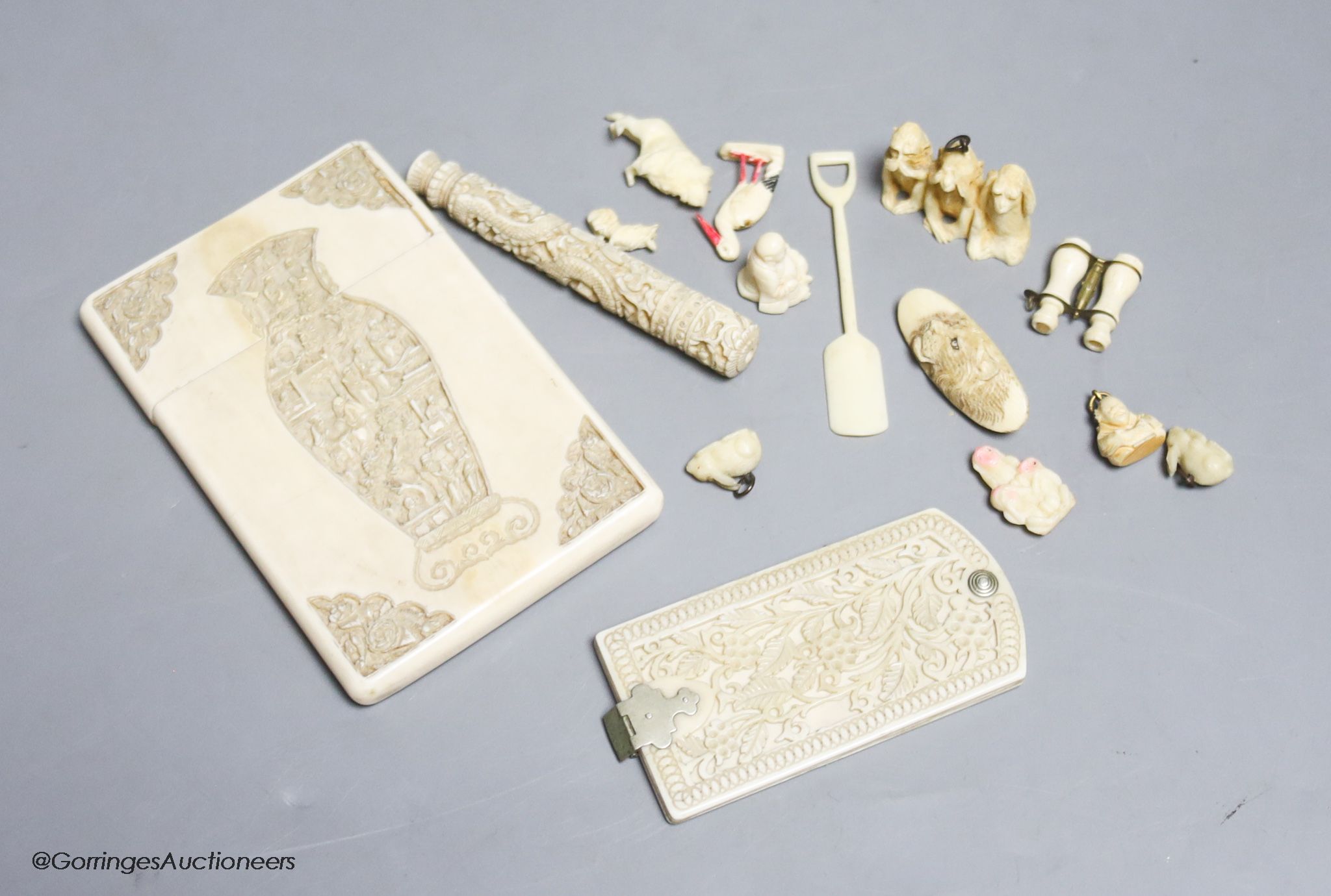 A late 19th century Chinese carved ivory card case, a similar needle case, an aide-memoire and sundries